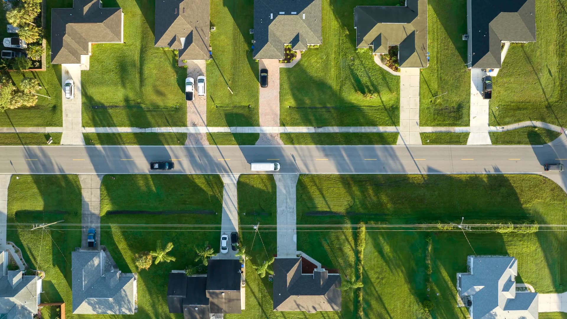 Aerial view of suburban neighborhood with immaculate green lawns in Shelby County, AL